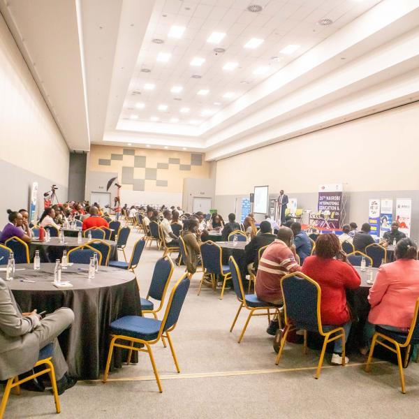 Delegates follow proceedings